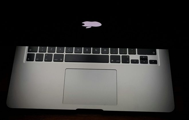 Dark MacBook with screen light